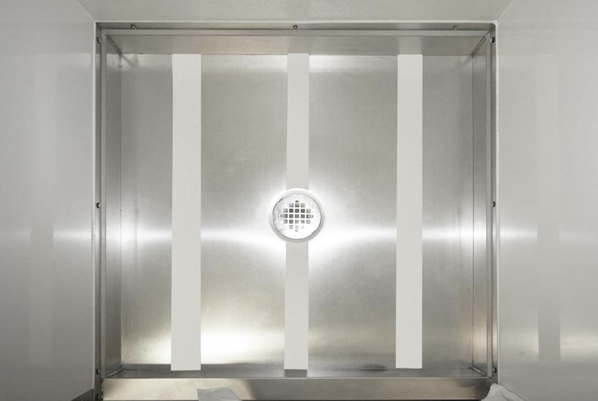 STAINLESS STEEL SHOWER PANS RESIST CONTAMINANTS
