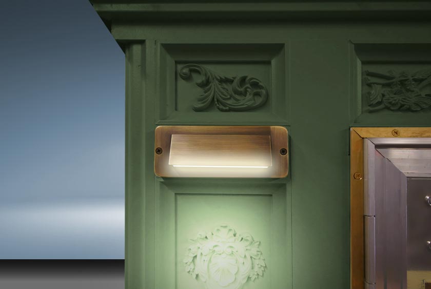 BRASS OR STAINLESS DOWNLIGHTS LIGHT UP THE FRONT FACADE TO ILLUMINATE THE WORK OF ART DESIGN