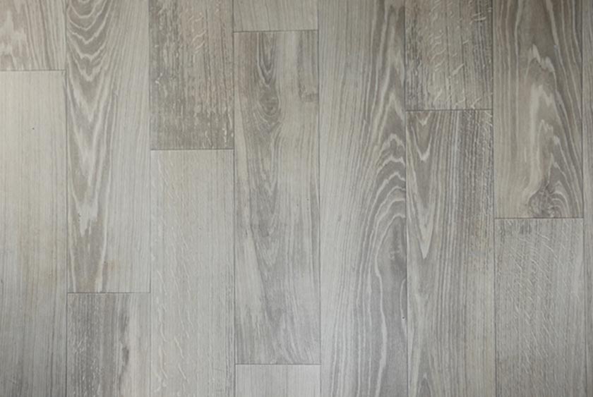 THE FLOORING IS A WIDE PLANK FAUX WOOD OR FAUX TILE FLOOR BY ARMSTRONG