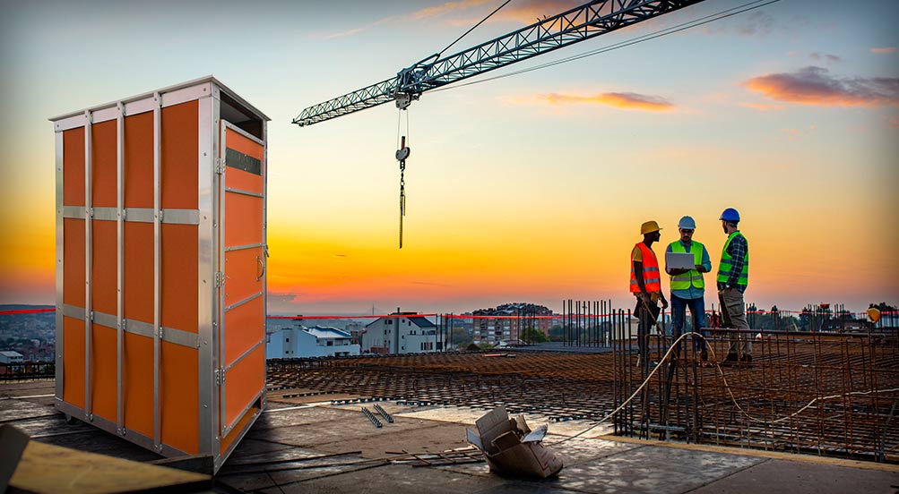 SkyWash Portable Sink | Orange SkyWash Portable Sink at a High Rise Building Construction Site.