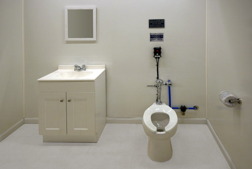 THE WASTE WATER ALARM SHOWN WITH THE COMMERCIAL TOILET SYSTEM
