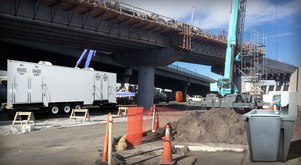 THE RESTROOM TRAILER AND WATER BASIN Near Construction Site