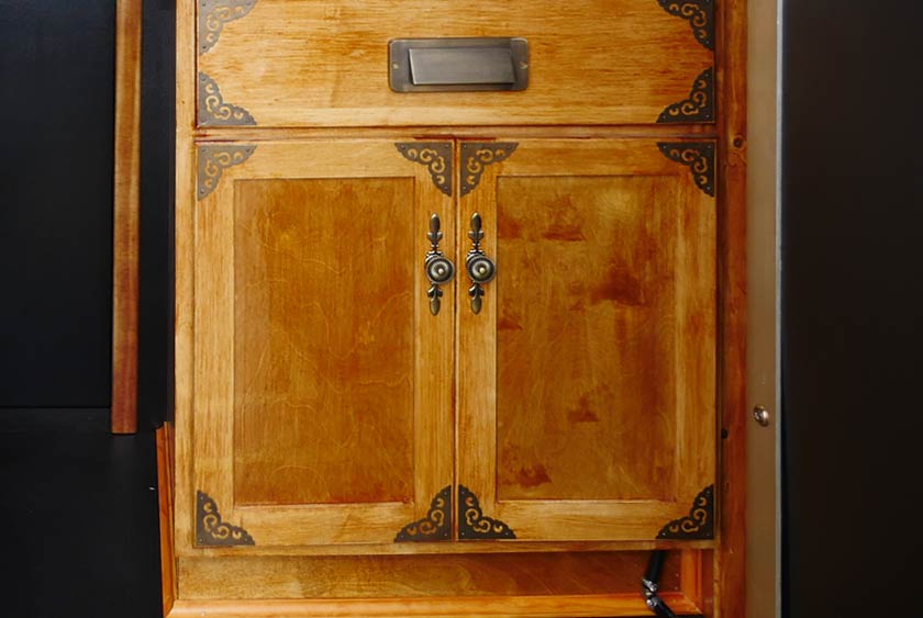 WOOD VANITY CABINET WITH GOLD ACCENTS AND CLASSIC HARDWARE