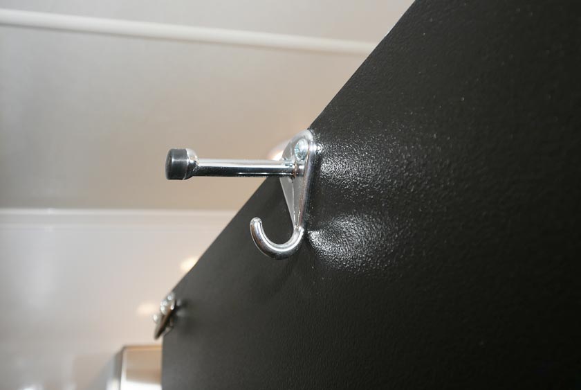 COAT AND HAT HOOKS ON EACH STALL DOOR FOR CONVENIENCE