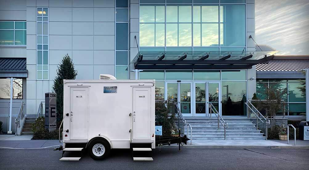 The Blue Steel Restroom Trailer Near Business Area