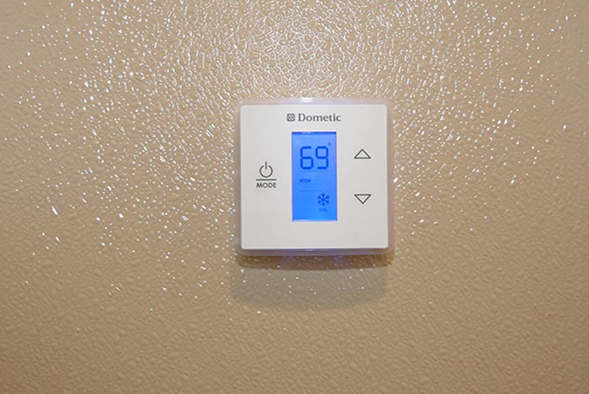 THERMOSTAT CONTROLLED DOMETIC HEAT AND AIR CONDITIONING SYSTEM