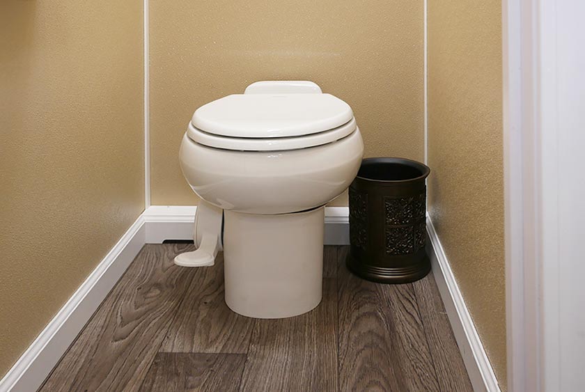 HANDS FREE FLUSHING TOILET BOWLS WITH TRASH RECEPTACLES IN EVERY BATHROOM STALL 
