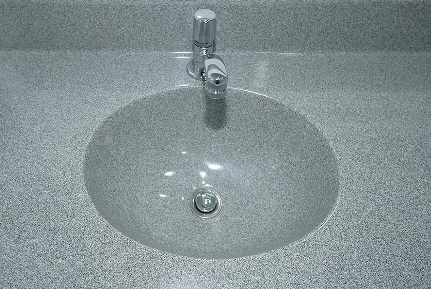 SINK BUILT INTO THE CORIAN COUNTERTOP