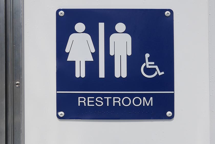 EXTERIOR SIGNAGE INDICATES ADA RESTROOM FOR ALL GENDERS