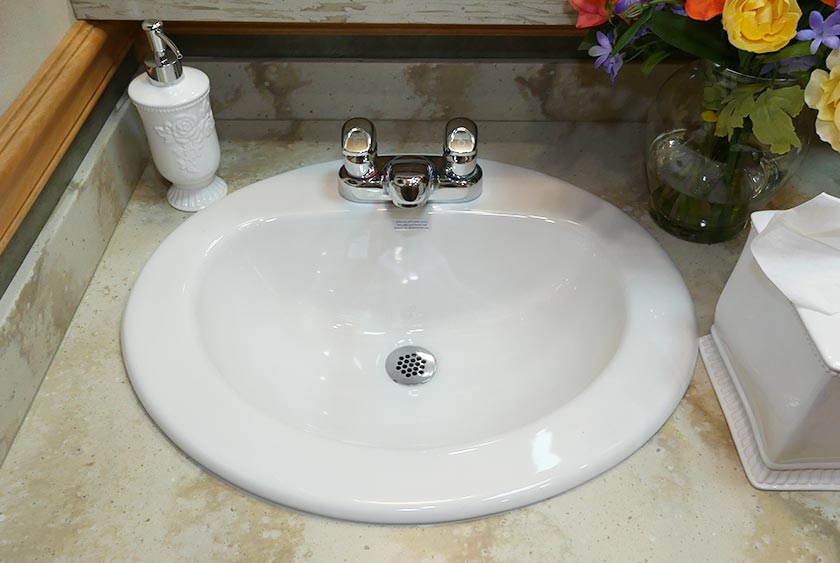 PORCELAIN SINKS AND CORIAN COUNTERTOPS IN VANITY