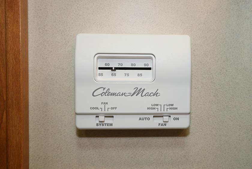 THERMOSTAT CONTROLLED COLEMAN MACH HEAT AND AIR CONDITIONING SYSTEM