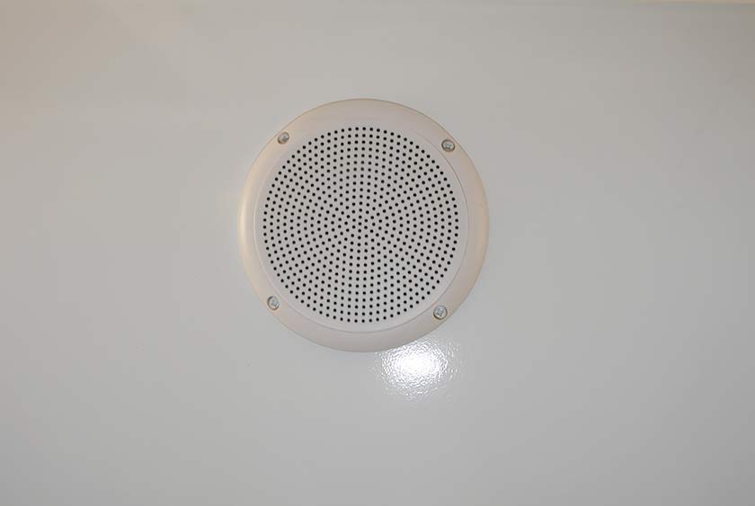 CENTRAL MUSIC SYSTEM WITH CEILING MOUNT SPEAKERS AND CD PLAYER/AM/FM STEREO