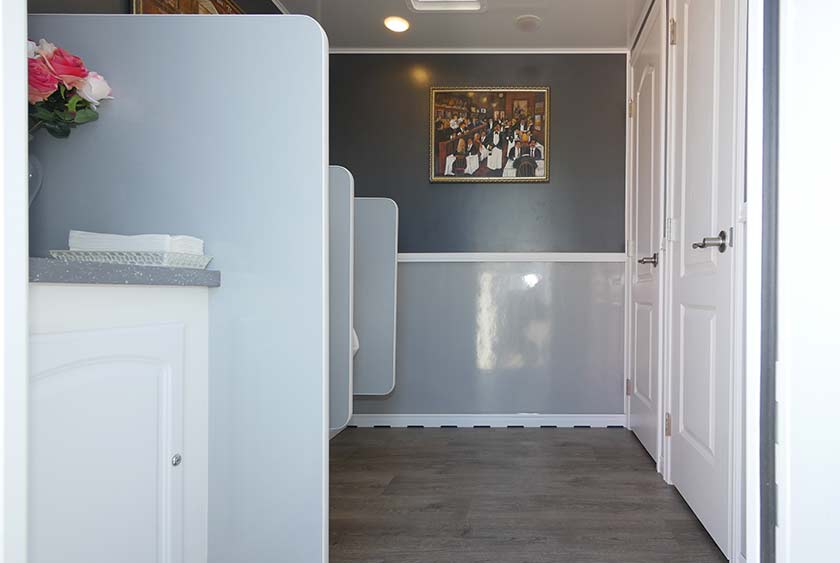 COMFORTABLE BATHROOM STALLS WITH FLOOR TO CEILING LOCKABLE DOORS