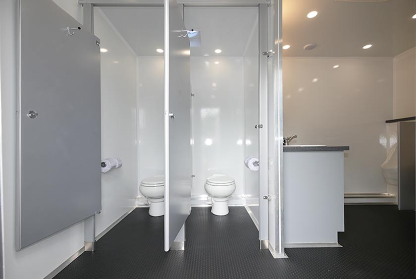 MEN’S RESTROOM HAS TWO PRIVATE BATHROOM STALLS 