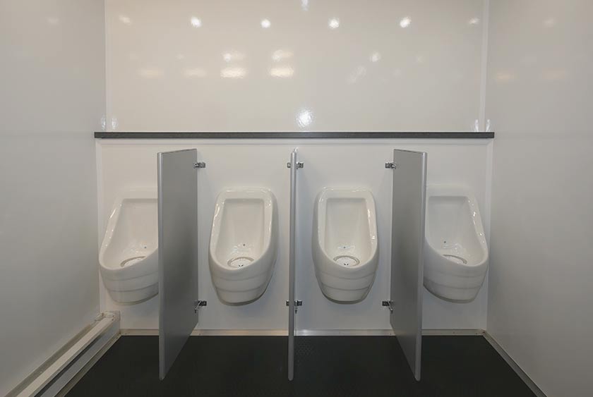 FOUR PORCELAIN URINALS WITH PRIVACY DIVIDERS 