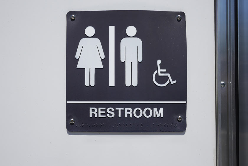 OUTDOOR SIGNAGE INDICATES ADA COMPLIANT RESTROOM FOR ALL SEXES