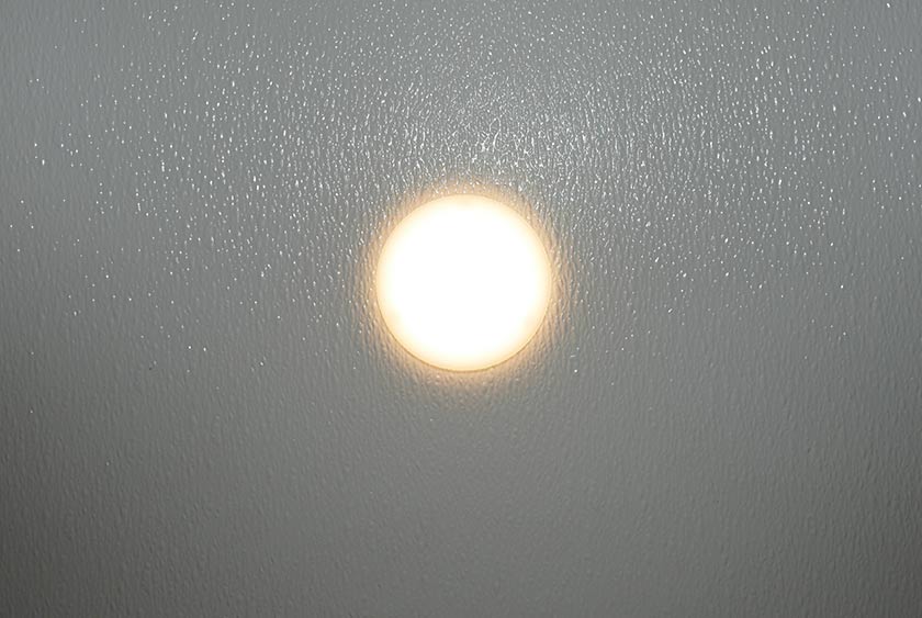 CEILING MOUNTED LED LIGHTING EFFICIENTLY ILLUMINATES THE RESTROOM TRAILER