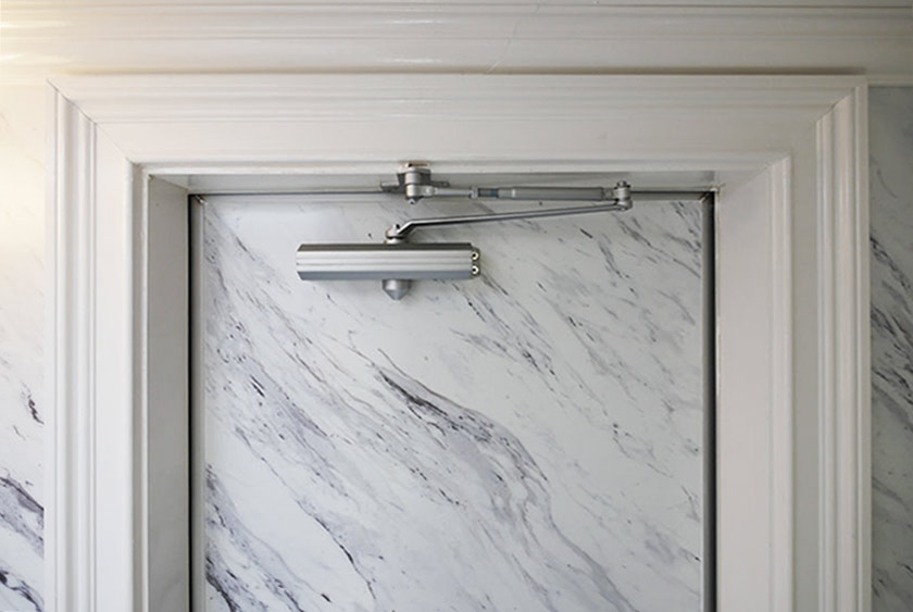 WHITE WOOD TRIM SURROUNDS DOORWAYS AND WAINSCOTING