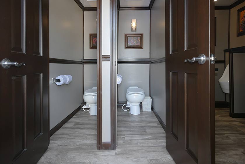 ROOMY STALLS HAVE FLOOR TO CEILING LOCKABLE DOORS FOR PRIVACY