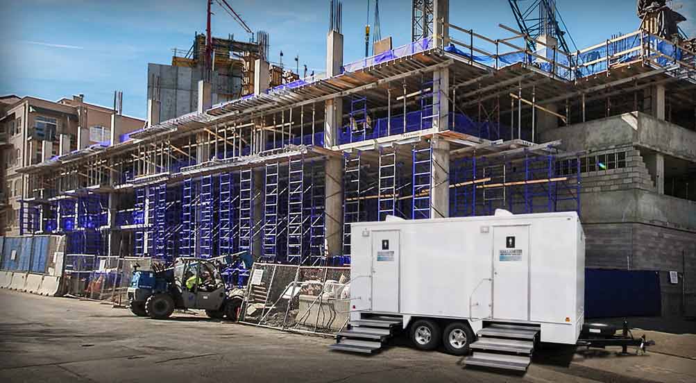 The Calverton Restroom Trailer Near Building Site