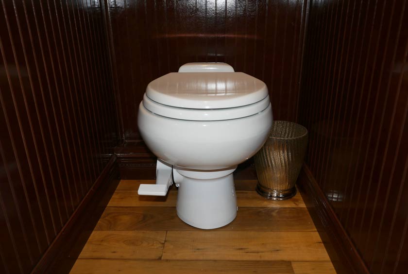 PORCELAIN TOILET WITH PEDAL FLUSH AND TRASH RECEPTACLE