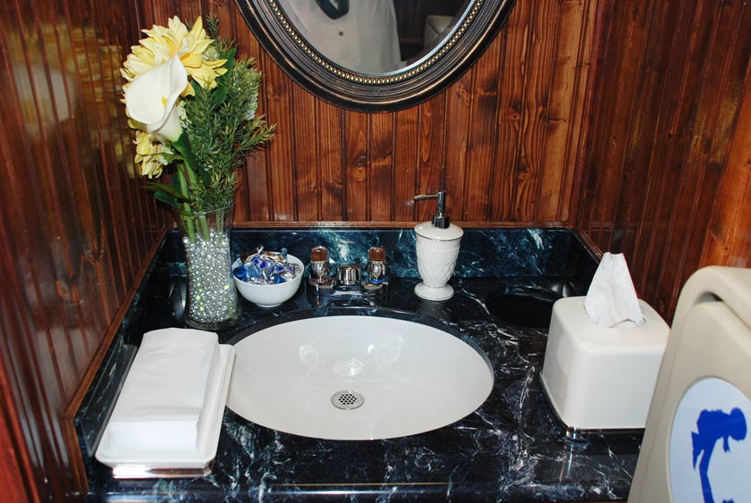 THIRD VANITY SINK WITHIN STALL WITH BABY CHANGING STATION