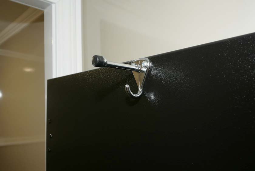 CONVENIENT COAT AND HAT HOOKS INSIDE TOILET STALLS