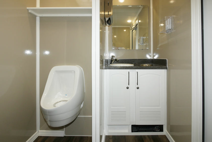 MEN'S SIDE INCLUDES PRIVATE BATHROOM STALL, SEPARATE URINAL AND SINGLE SINK VANITY