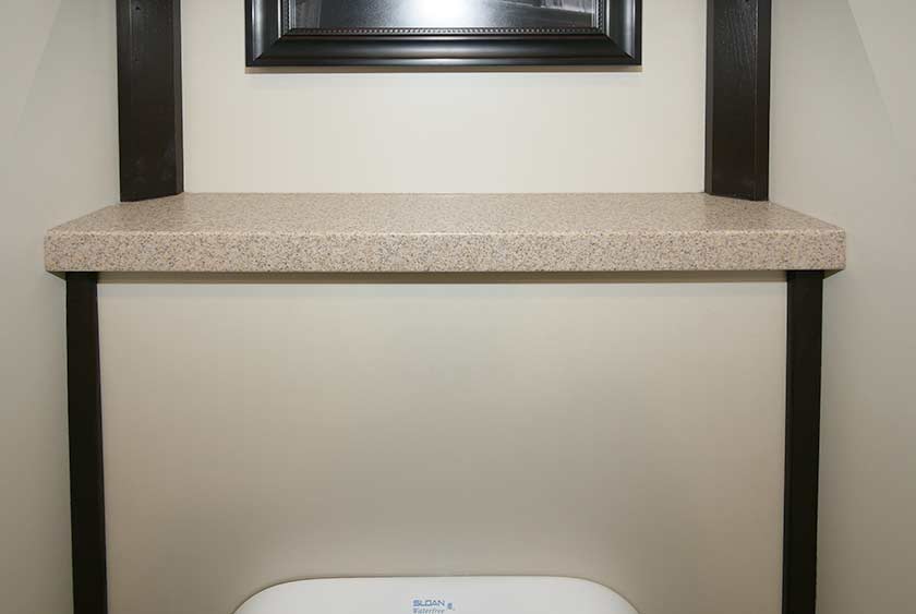 CONVENIENCE SHELF LOCATED ABOVE URINAL