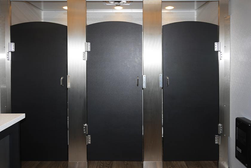 EACH STALL HAS A SOLID LOCKING DOOR FOR PRIVACY
