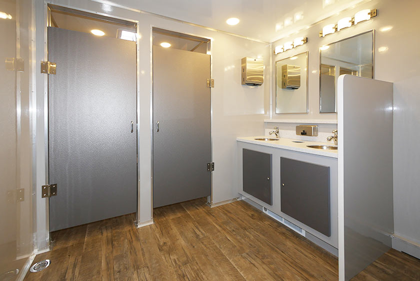 WOMEN'S SIDE WITH DOUBLE SINK VANITY AND FOUR BATHROOM STALLS