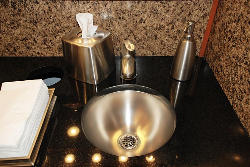 STAINLESS STEEL SINKS WITHIN MARBLE COUNTERTOP PROVIDE CONTEMPORARY FEEL