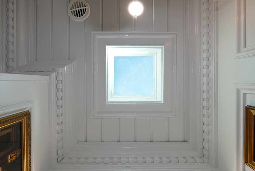 CEILING VIEW OF DETAILED WAINSCOTING WITH SKYLIGHT