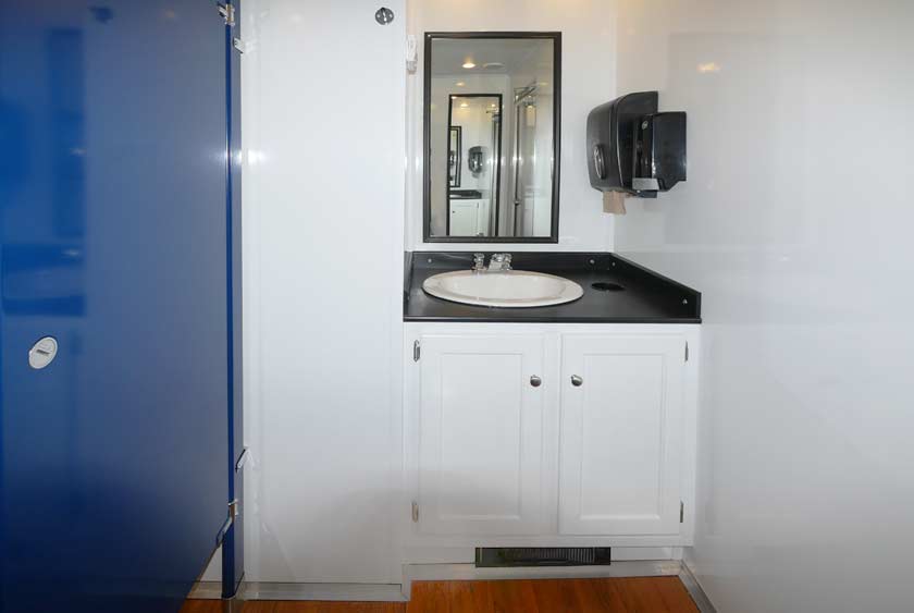 FUNCTIONAL VANITIES INCLUDE BUILT-IN TRASH RECEPTACLES