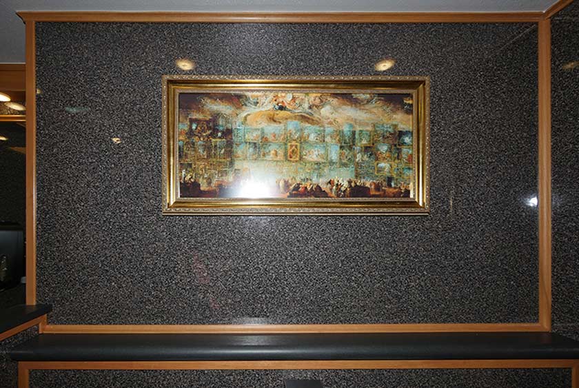 CONVENIENCE SHELF SPANS THE WIDTH OF URINAL AREA