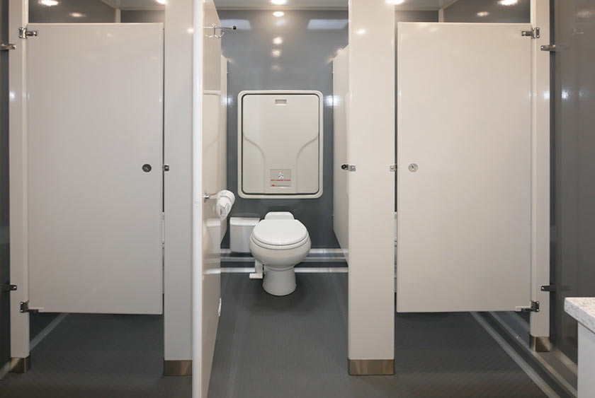 BABY CHANGING STATION INSIDE ONE OF THE LADIES BATHROOM STALLS