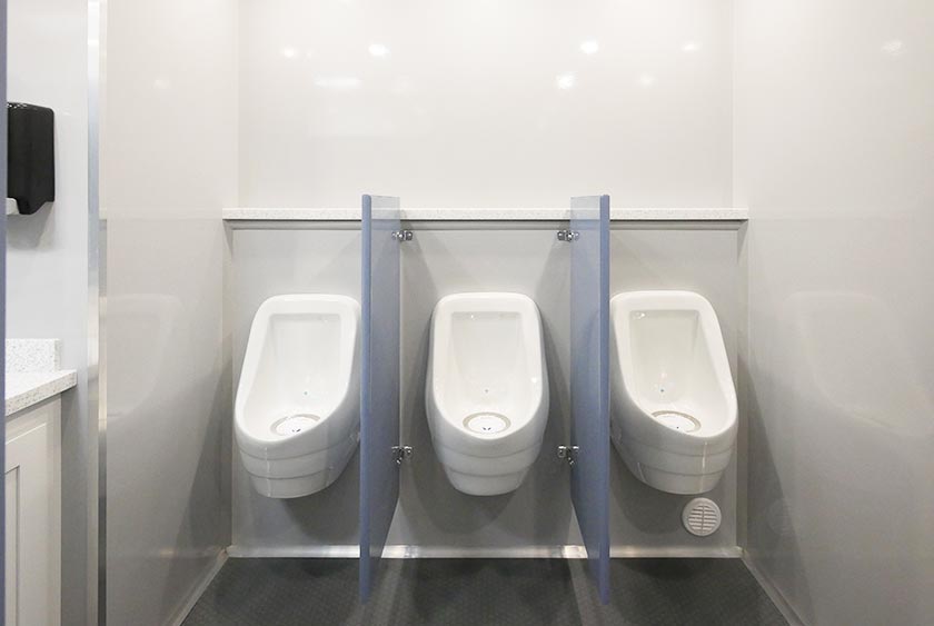 THREE PORCELAIN ODORLESS URINALS