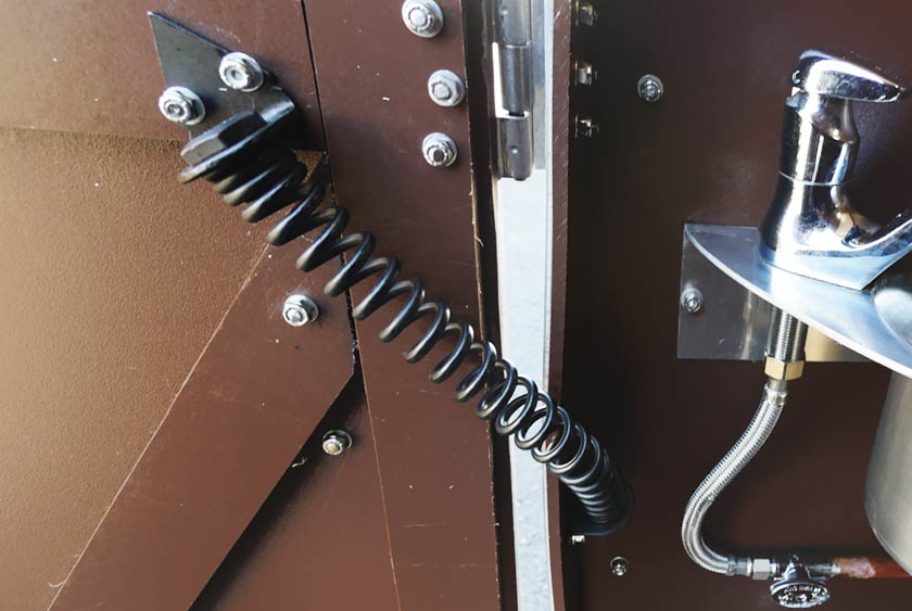 SPRING LOADED SELF CLOSING DOOR