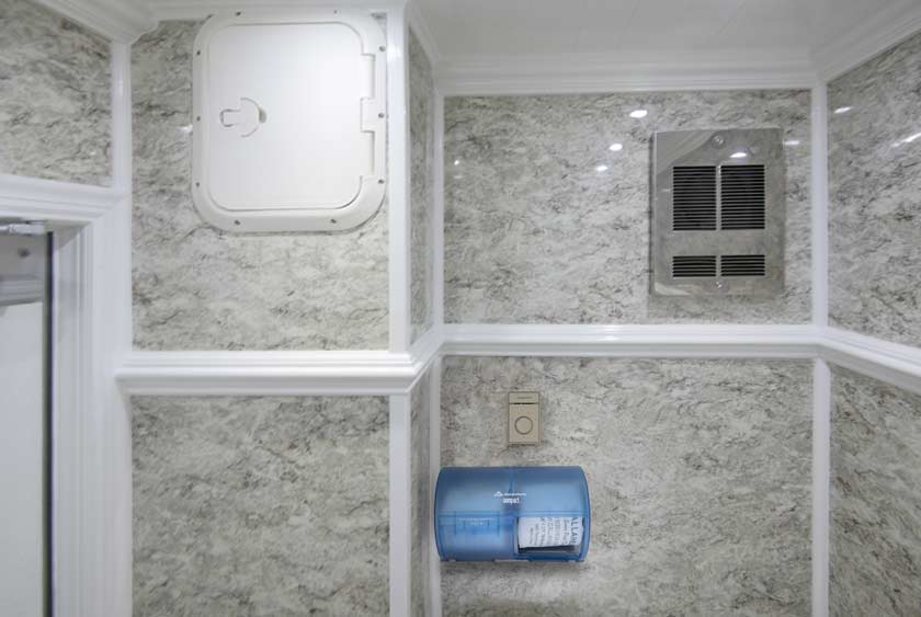 CLEAN LINES AND FAUX MARBLE WALLS KEEP INTERIOR LIGHT AND BRIGHT